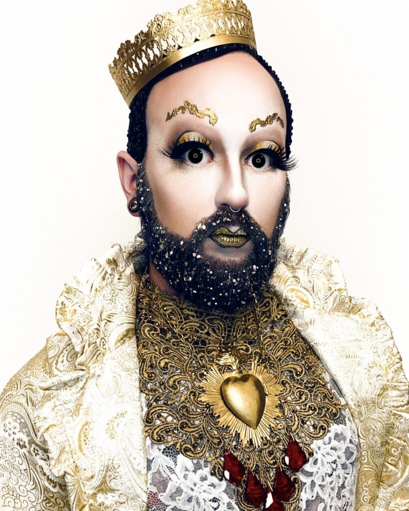 Apostrophe wearing Elektra Cosmetics Gold Creative Capsule