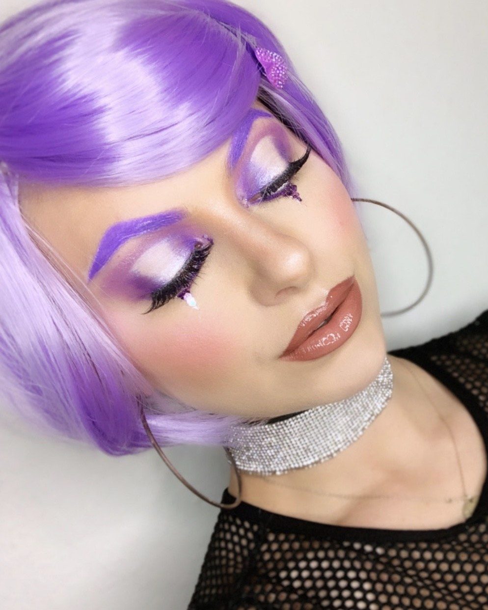 Piper Wearing Elektra Cosmetics Purple Creative Capsule