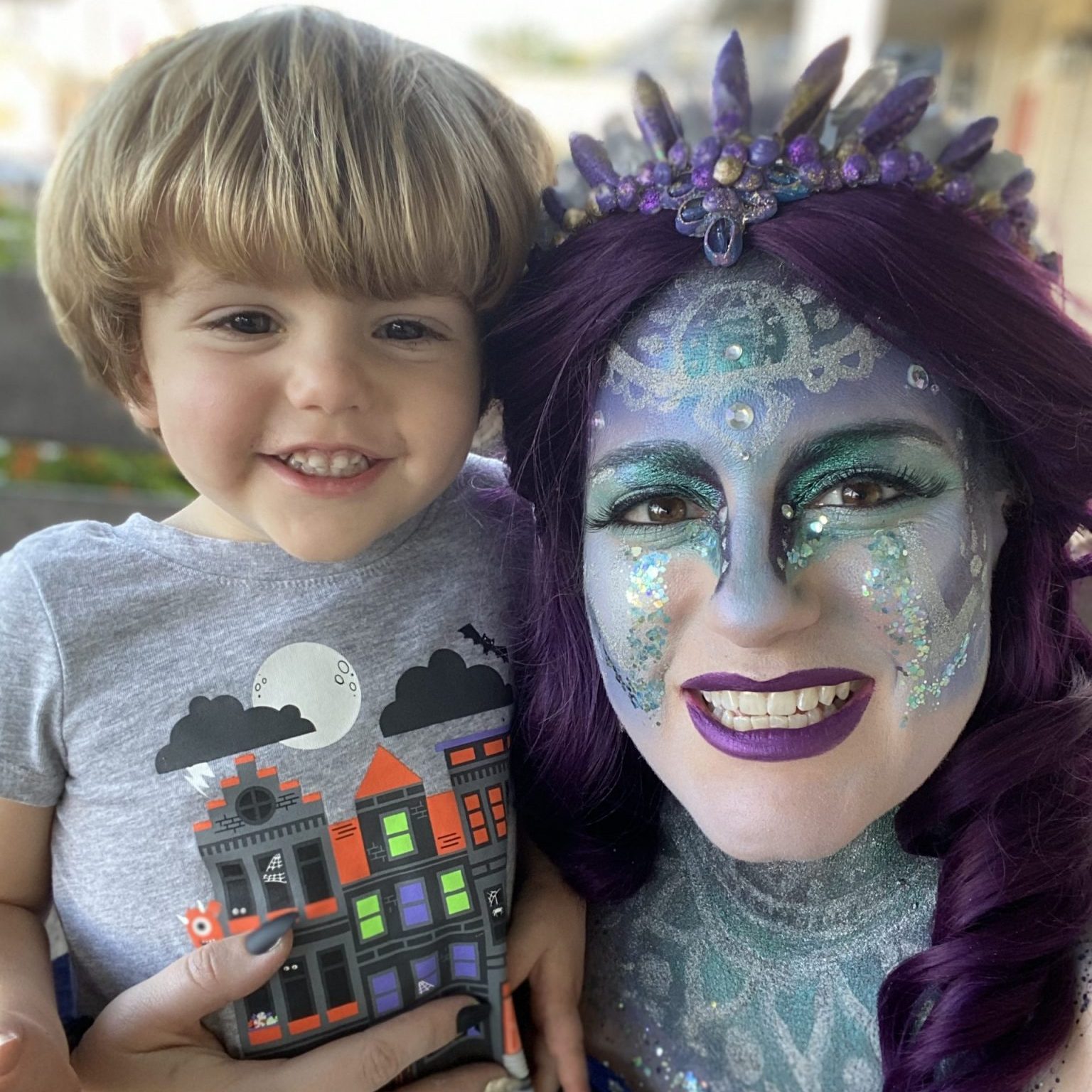 Caroline Rosa Wearing Elektra Cosmetics Purple Creative Capsule and Her Son